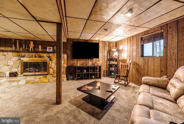 716 Marshall St, Edgewater Park, NJ 08010 - carpeted living room with wooden walls and a stone fireplace