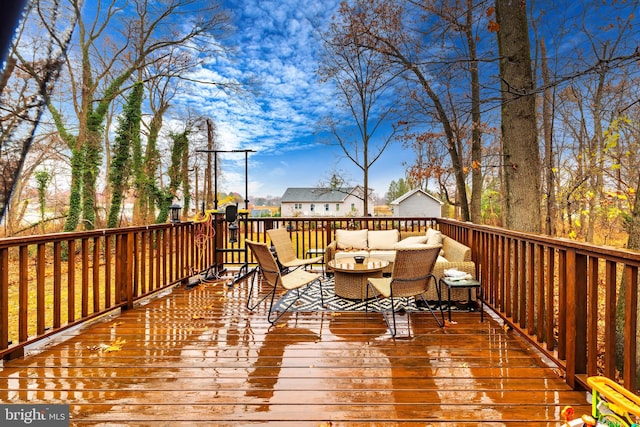 wooden deck featuring an outdoor living space