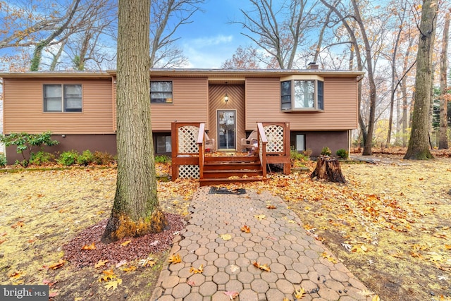 716 Marshall St, Edgewater Park, NJ 08010 - view of front of property with a deck and a chimney
