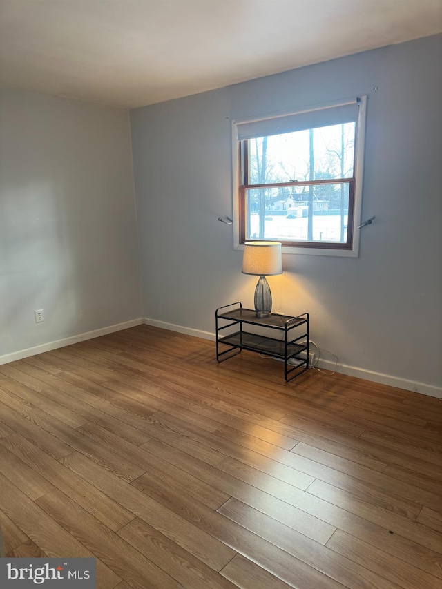 unfurnished room featuring wood-type flooring