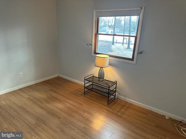 spare room with light wood-type flooring