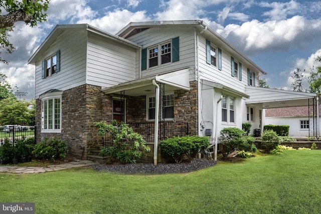 view of front of home with a porch and a front yard