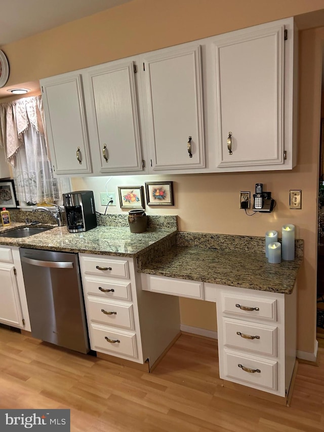 9221 Greenhouse Cir, Nottingham, MD 21236 - kitchen featuring stainless steel dishwasher, white cabinetry, light wood-style flooring, and stone counters