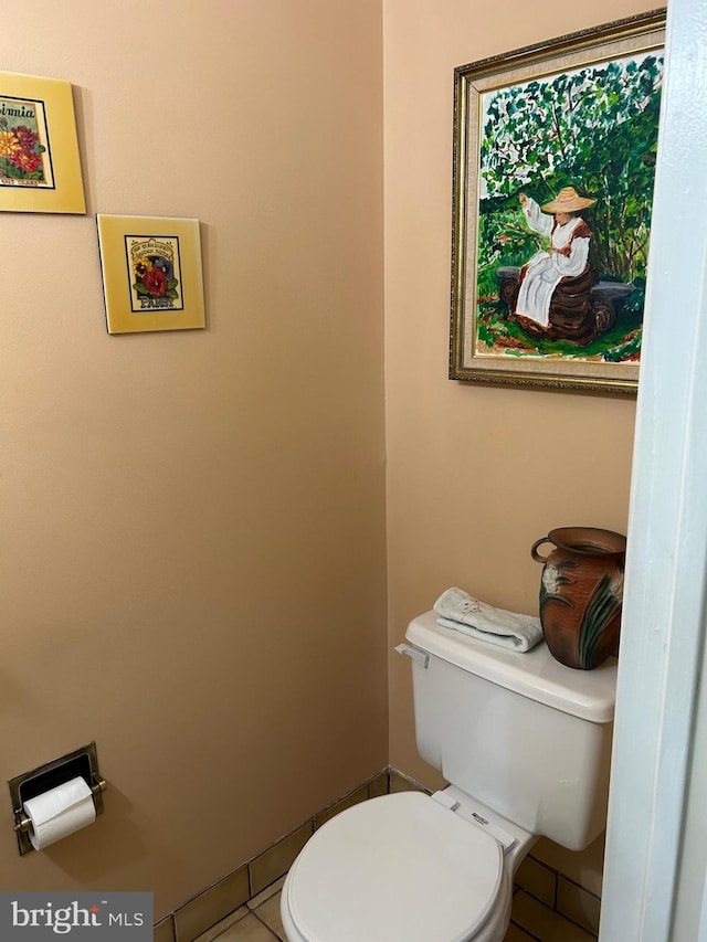 bathroom with tile patterned floors and toilet