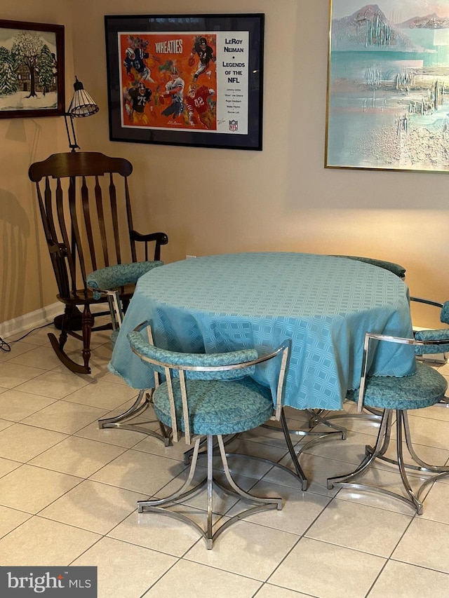 dining space with tile patterned floors