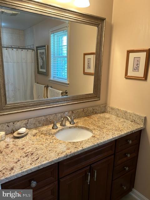 9221 Greenhouse Cir, Nottingham, MD 21236 - bathroom with vanity and a shower with curtain