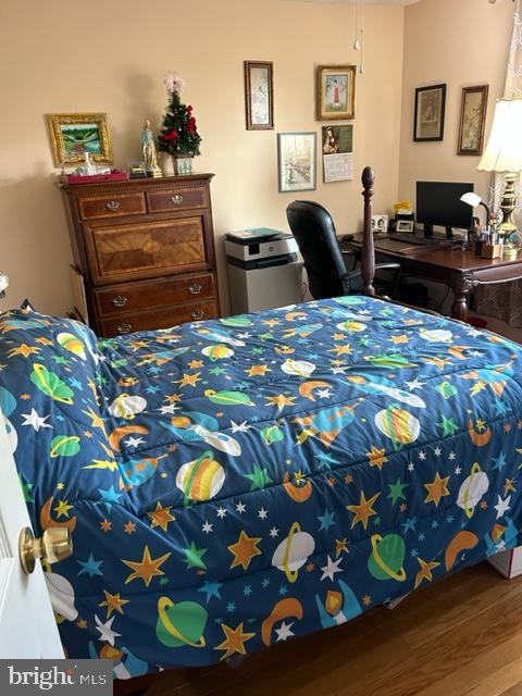 bedroom featuring hardwood / wood-style flooring