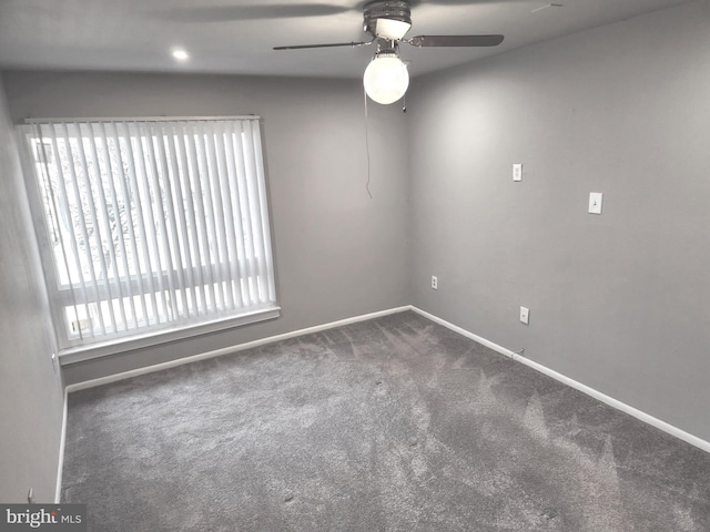 carpeted empty room with ceiling fan