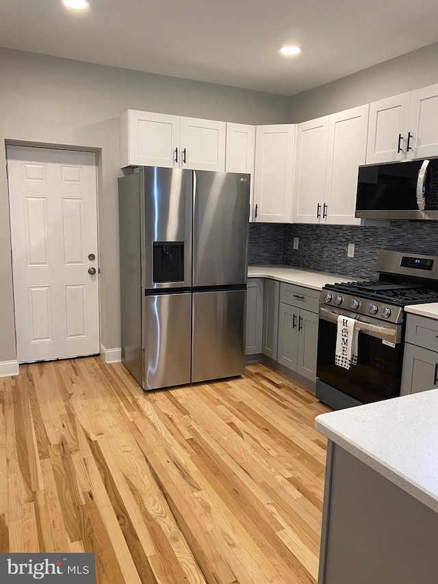 365 Union Aly, Pottstown, PA 19464 - kitchen featuring stainless steel appliances, light countertops, light wood finished floors, tasteful backsplash, and recessed lighting