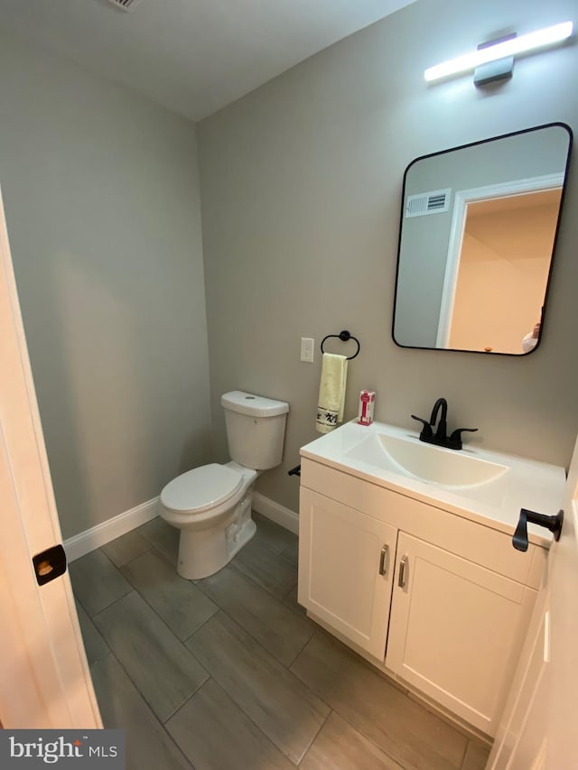 365 Union Aly, Pottstown, PA 19464 - bathroom featuring toilet, vanity, and baseboards