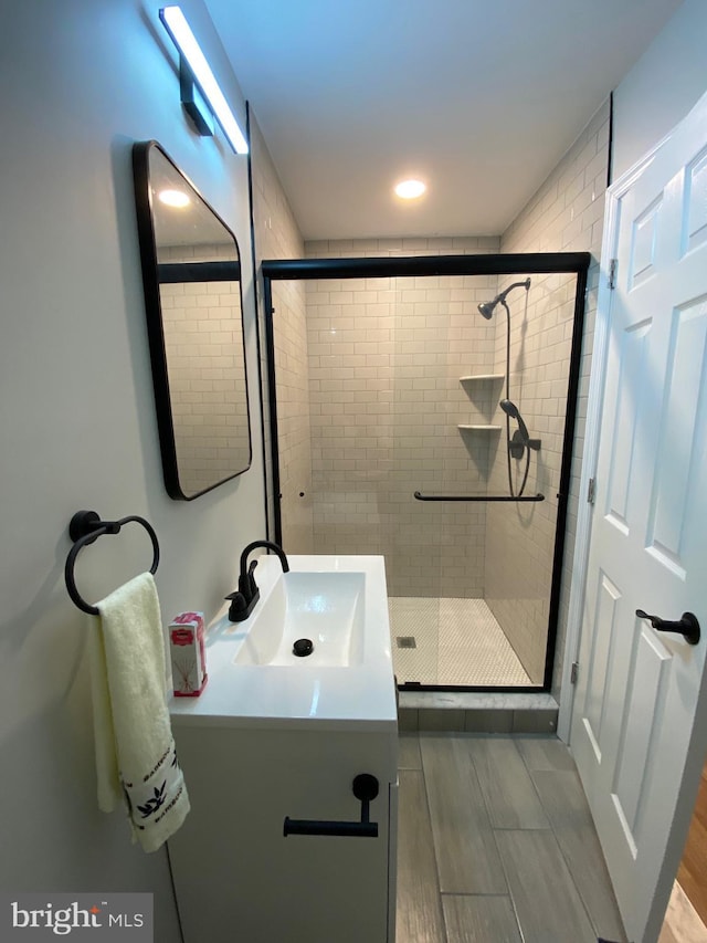 365 Union Aly, Pottstown, PA 19464 - full bathroom with vanity, a stall shower, and wood finished floors
