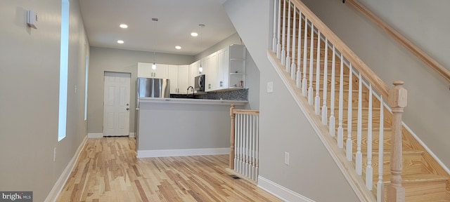 staircase featuring hardwood / wood-style floors