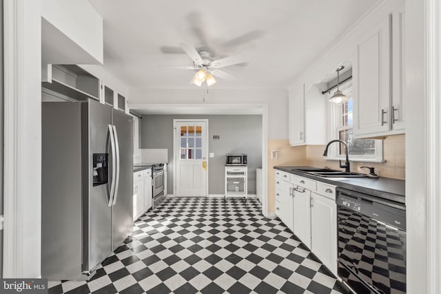 kitchen with plenty of natural light, white cabinetry, sink, and appliances with stainless steel finishes