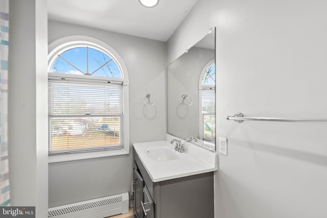 bathroom featuring vanity and a baseboard heating unit