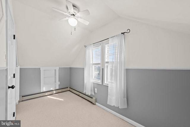 bonus room featuring carpet, lofted ceiling, ceiling fan, pool table, and a baseboard radiator