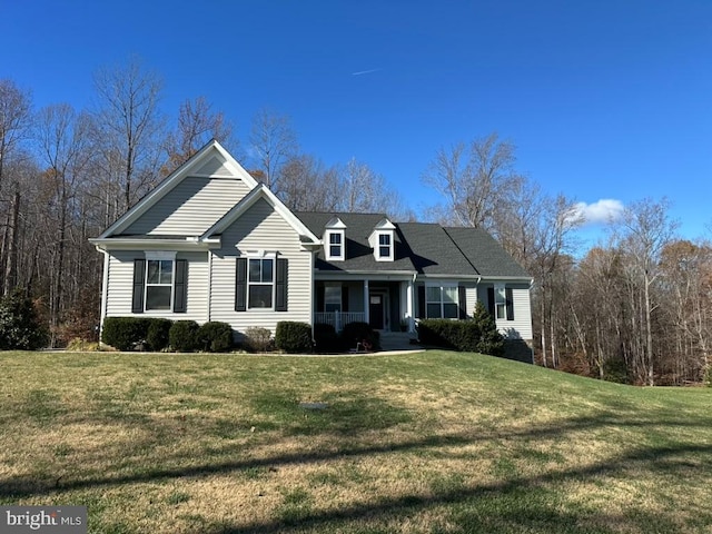 view of front of home with covered porch and a front yard