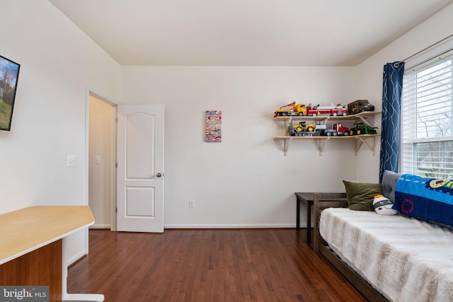 bedroom featuring dark hardwood / wood-style flooring