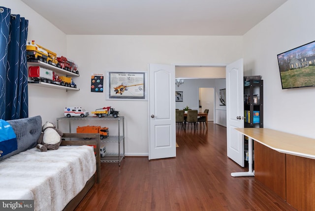 bedroom featuring dark hardwood / wood-style flooring