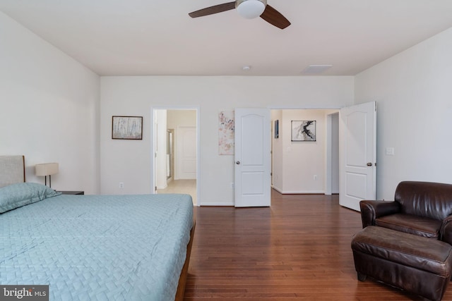 bedroom with ceiling fan and dark hardwood / wood-style floors