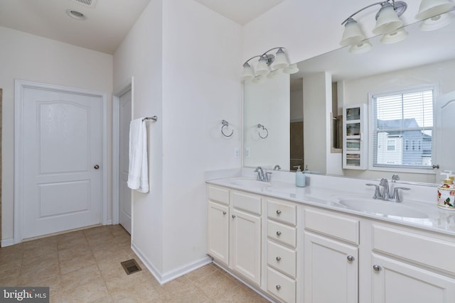 bathroom featuring tile patterned floors and vanity