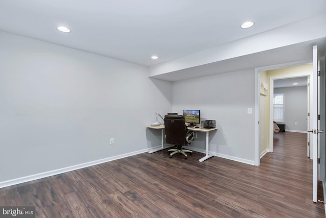 home office with dark wood-type flooring