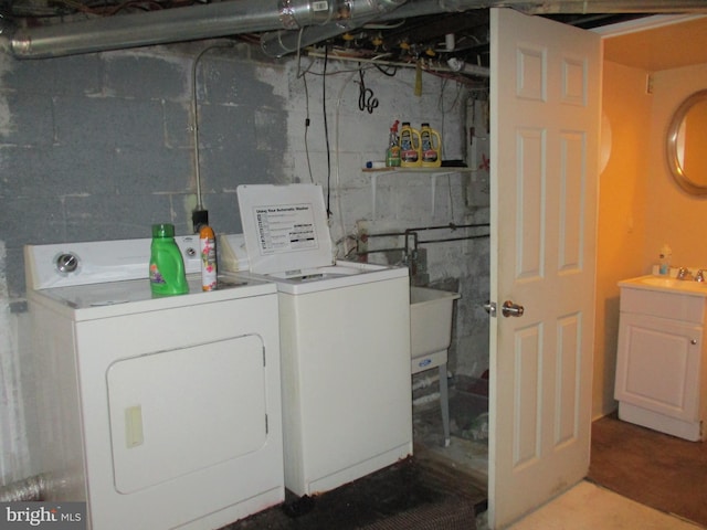 clothes washing area featuring independent washer and dryer