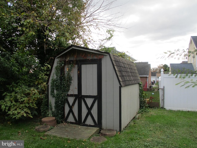 view of outbuilding with a lawn