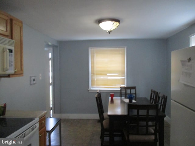 dining space with a healthy amount of sunlight