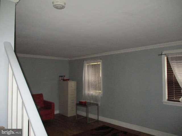 interior space with hardwood / wood-style flooring and ornamental molding