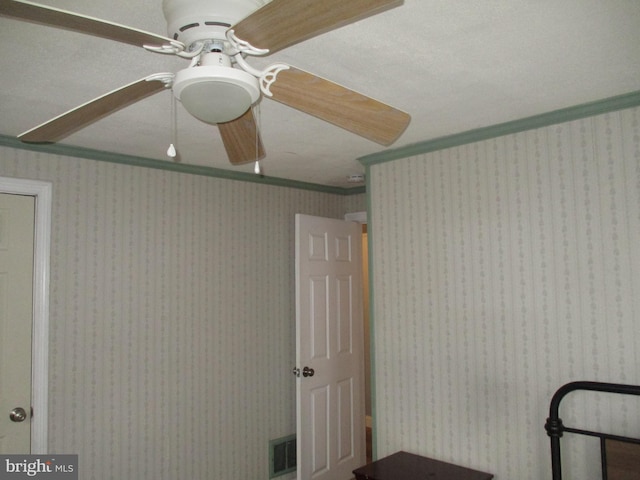 unfurnished bedroom with ornamental molding and ceiling fan