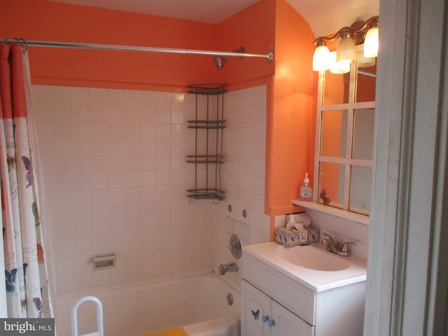 bathroom featuring vanity and shower / bath combo with shower curtain