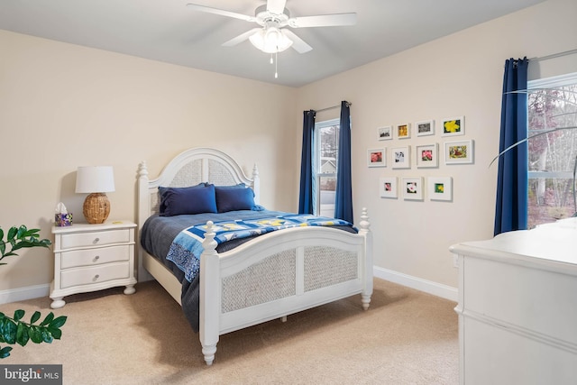 bedroom featuring ceiling fan and light colored carpet