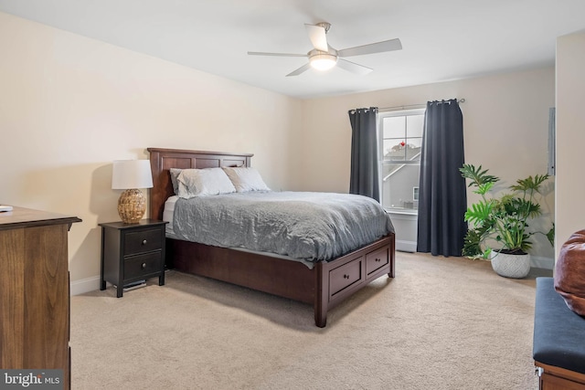 bedroom with ceiling fan and light carpet