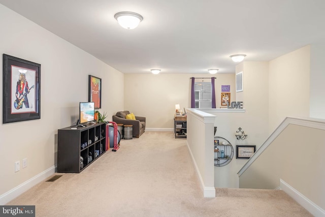 hallway with light carpet