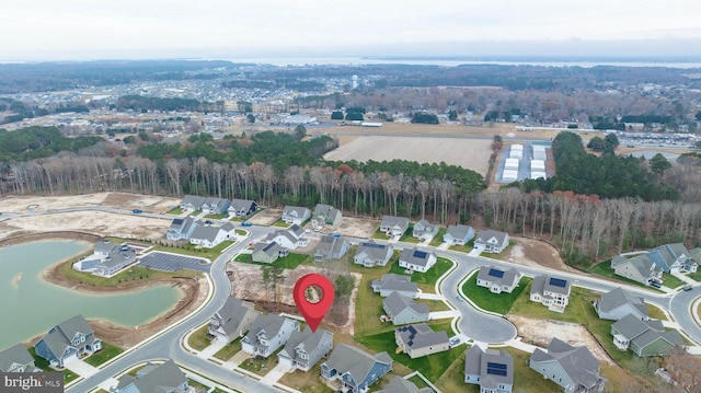 birds eye view of property featuring a water view