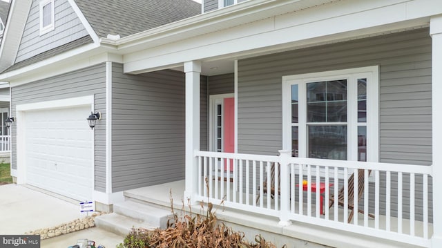 doorway to property with a garage