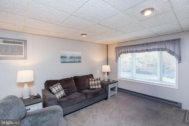 living room featuring a wall mounted air conditioner, a paneled ceiling, carpet, and a baseboard radiator