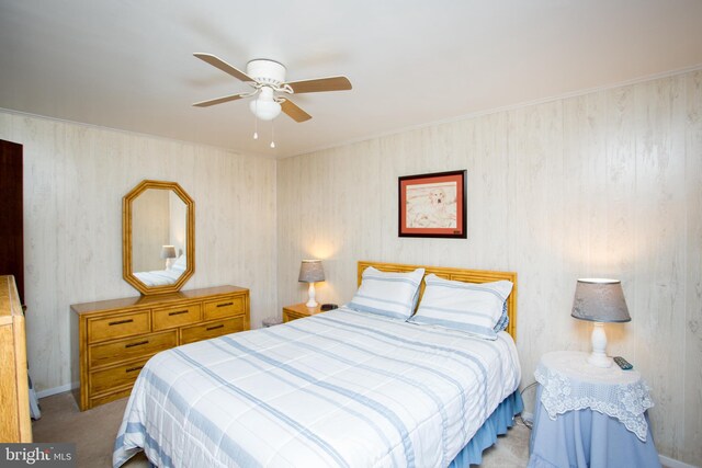 bedroom featuring ceiling fan and carpet