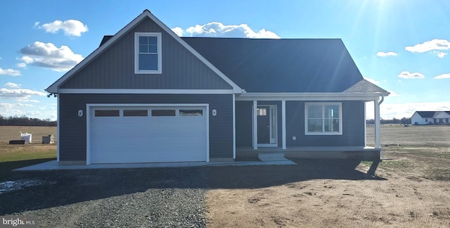 view of front facade with a garage and covered porch