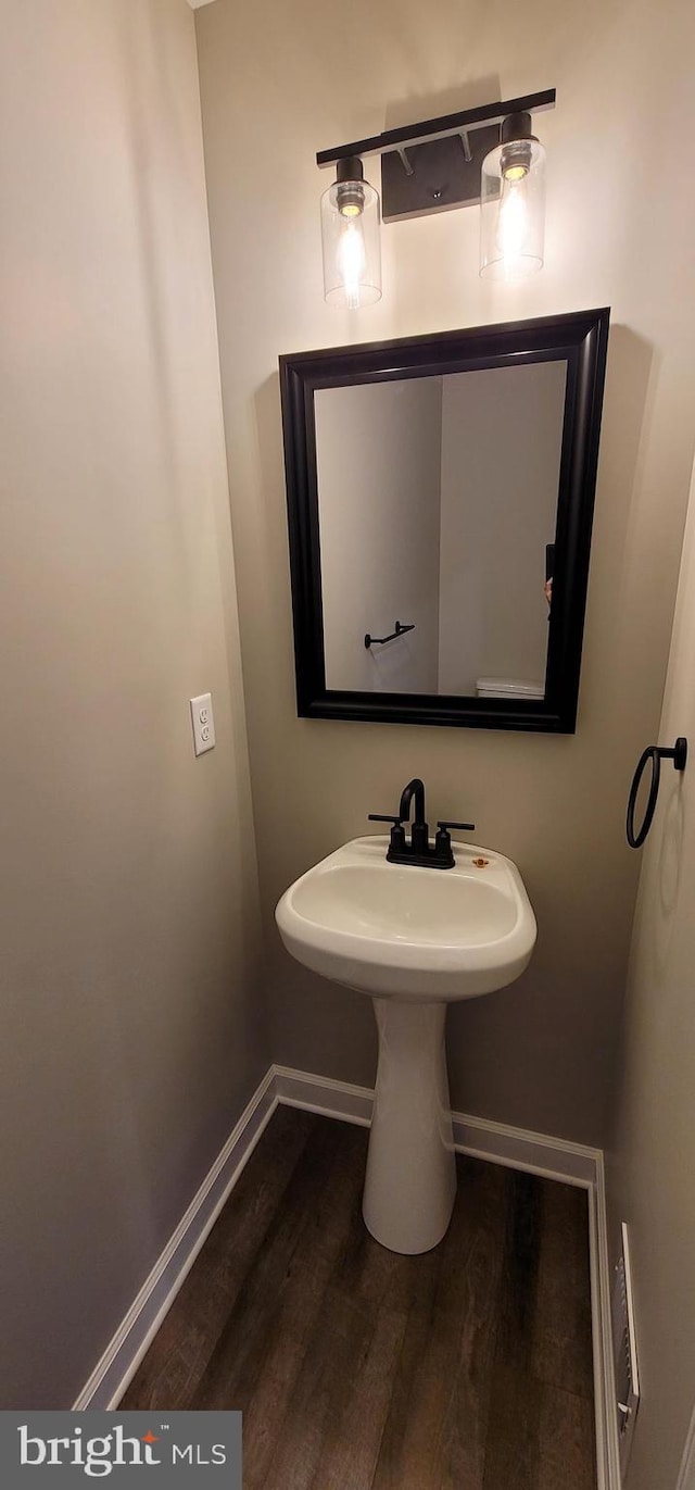 bathroom with wood-type flooring