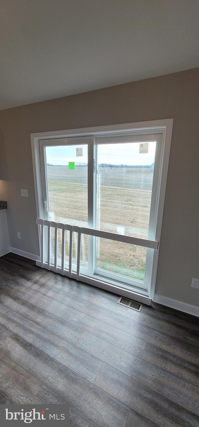 unfurnished room featuring hardwood / wood-style flooring