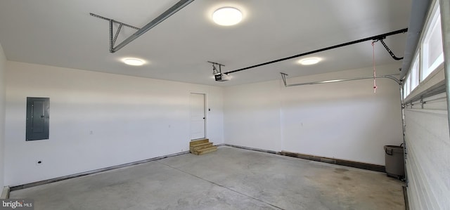 garage featuring a garage door opener and electric panel