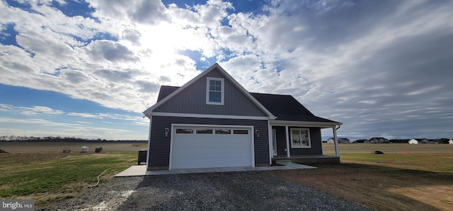 view of front facade featuring a rural view and a front yard