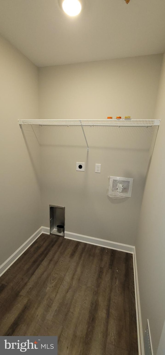 laundry room with dark hardwood / wood-style flooring and electric dryer hookup