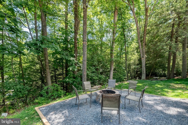 view of patio with an outdoor fire pit