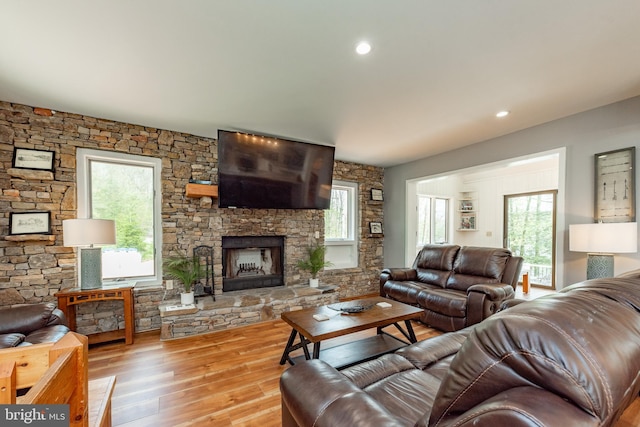 living room featuring a fireplace and light hardwood / wood-style floors