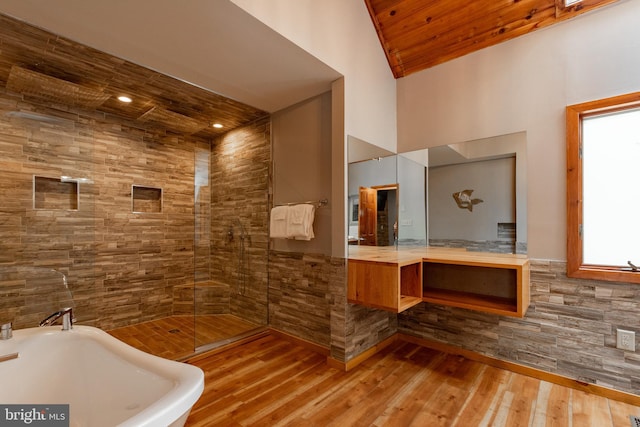 bathroom featuring wood-type flooring, vaulted ceiling, shower with separate bathtub, vanity, and wood ceiling