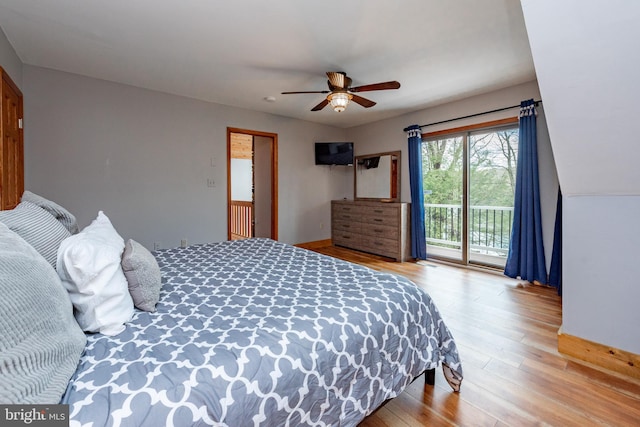 bedroom with access to outside, ceiling fan, and hardwood / wood-style floors