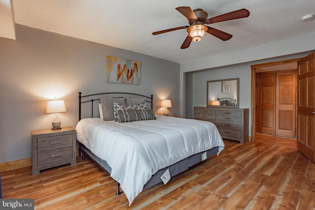 bedroom with ceiling fan and light hardwood / wood-style flooring