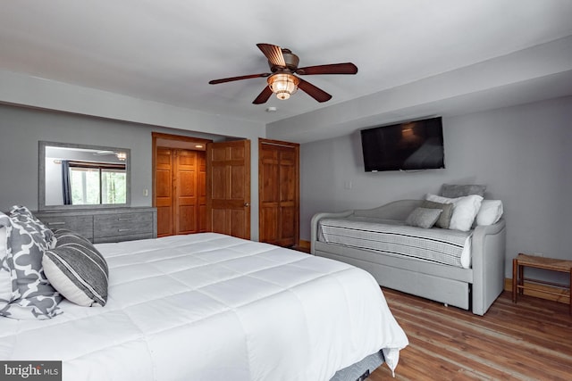 bedroom with ceiling fan and hardwood / wood-style floors